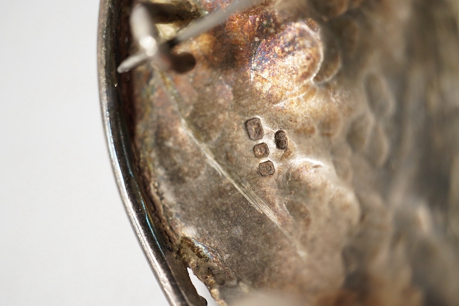 Elaine Coyne- A late 1980's modernist silver and cabochon garnet set drop brooch, 11.8cm, a pair of similar silver circular ear clips and a 1980's silver, carnelian, adventurine quartz and amethyst set brooch. Condition